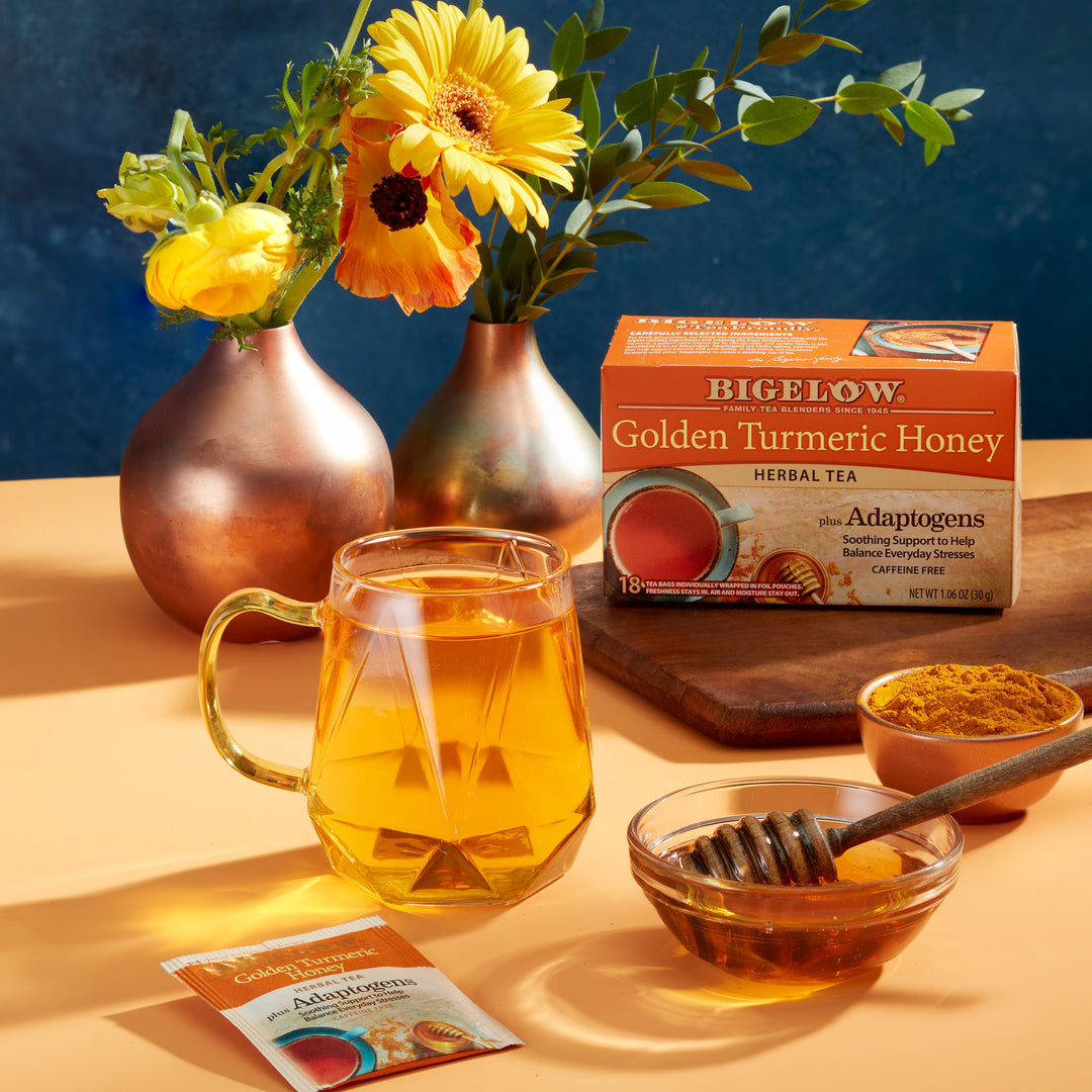 Glass of Bigelow Golden Turmeric Honey Herbal Iced Tea on a tray