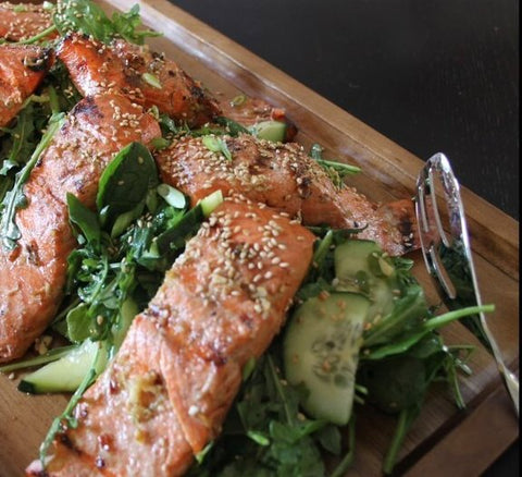 Tea Marinated Cedar Salmon over Sesame-Honey Greens