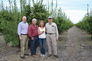 Bigelow Tea | Photo of Cindi Bigelow with family of lemon farmers