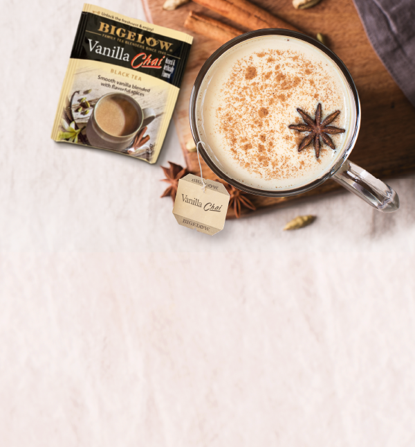 Vanilla Chai foil packet with mug of chai tea on white background