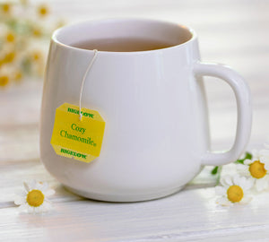 Bigelow Tea | Cup of tea with Cozy Chammomile tea tag displayed