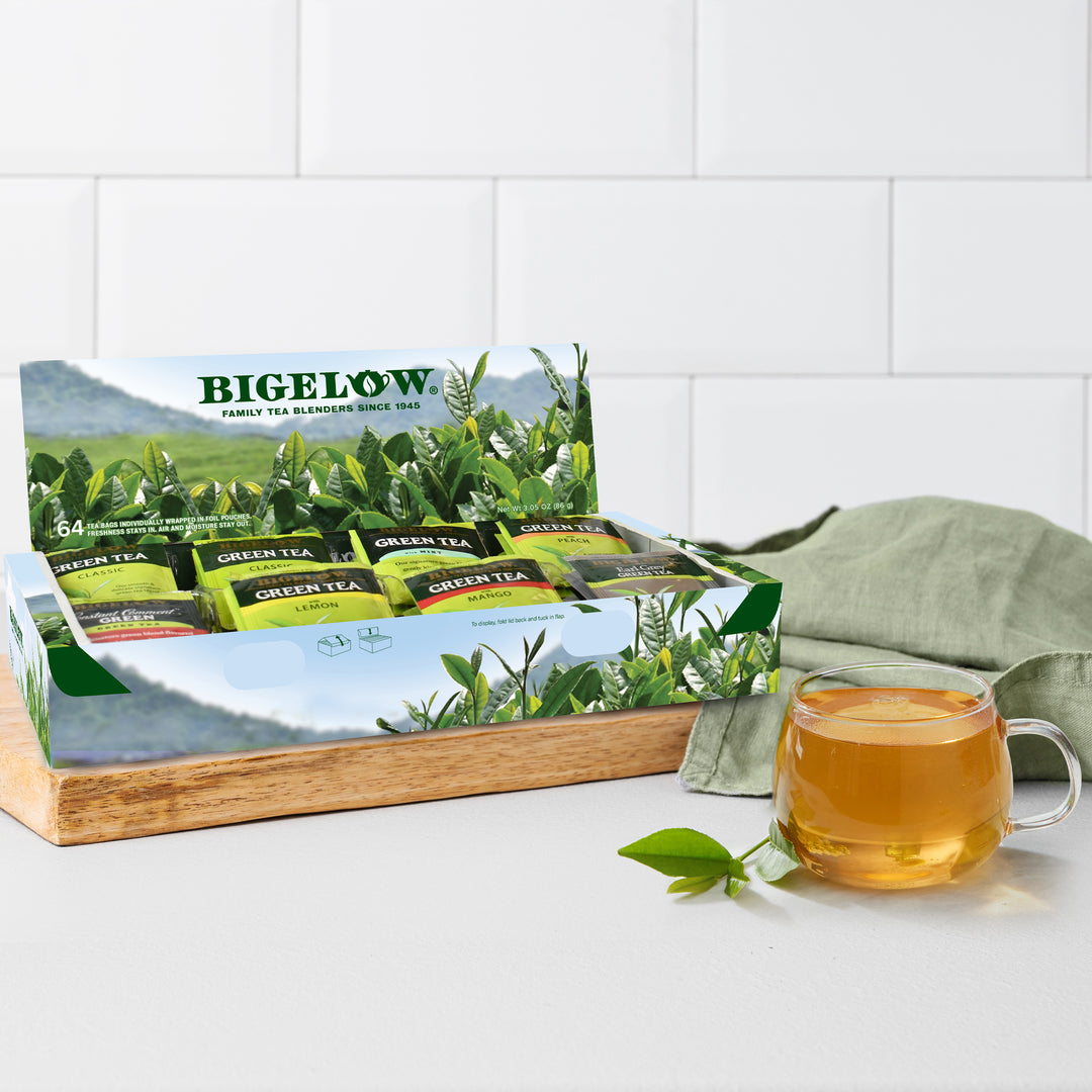 Bigelow green tea box with a cup of tea on a white surface