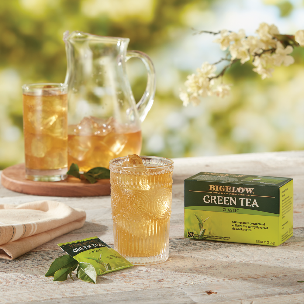 Bigelow Green Tea Iced in a glass and pitcher with a box of Green Tea