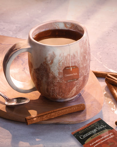 Cup of Cinnamon Stick with foil and cinnamon stick 