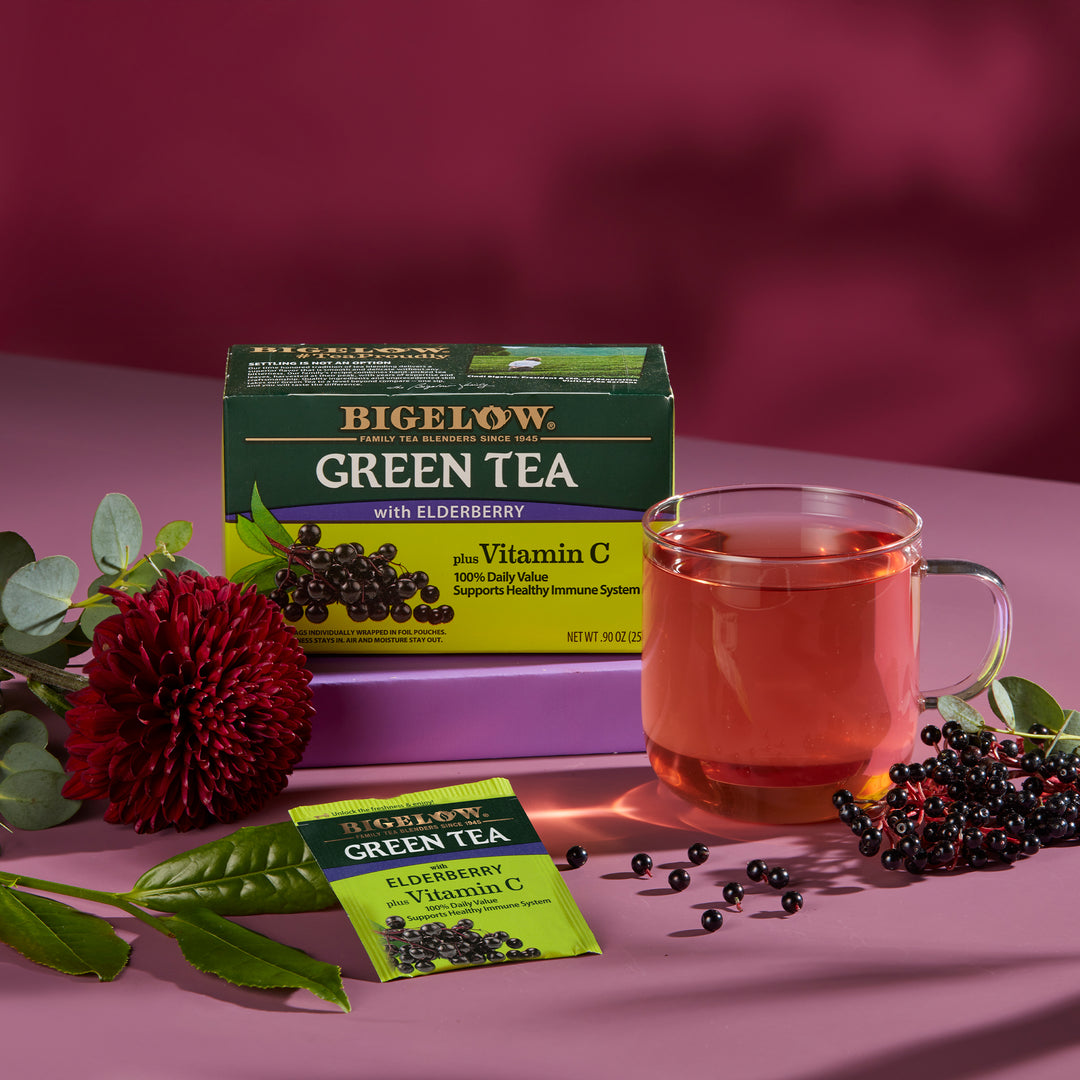 Glass Cup of Green Tea with Elderberry plus Vitamin C with tea box