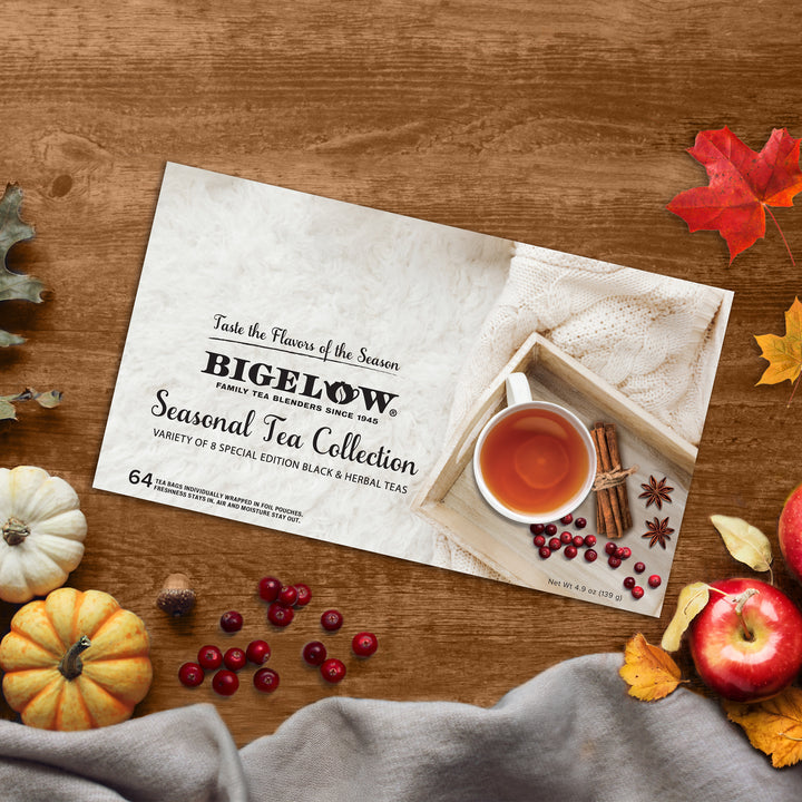 Bigelow Seasonal Tea Collection package on a wooden surface with autumn decorations.
