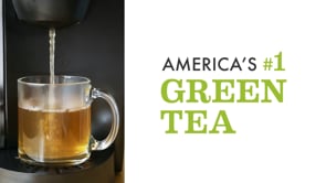 k-cup brewer with glass mug of tea with America's number one green tea text
