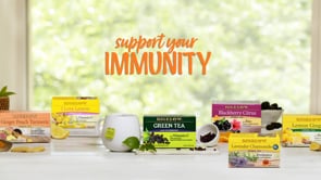 Support Your Immunity text with 6 boxes of Bigelow Tea on counter top with window in background