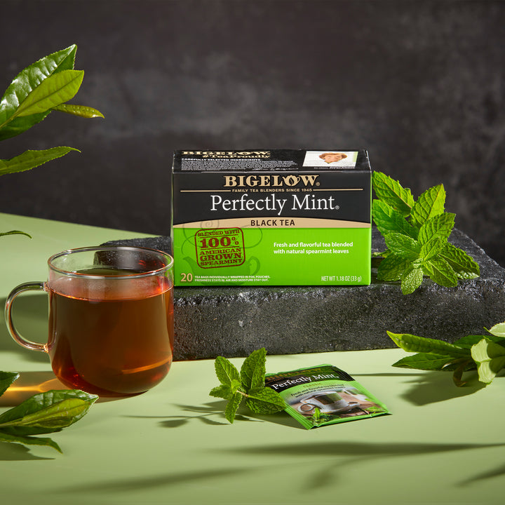 Glass mug of Perfectly Mint Black Tea and tea box