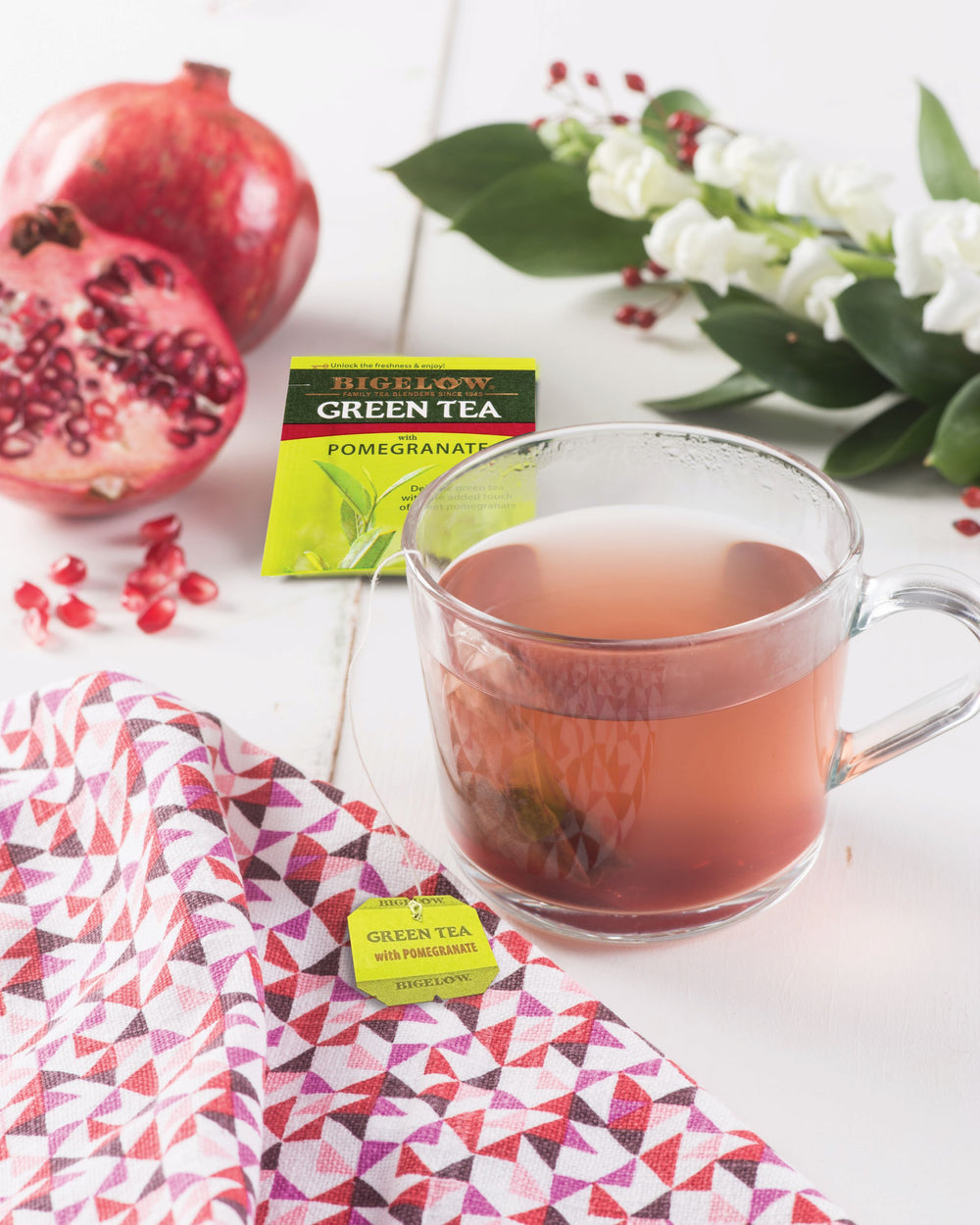 Glass mug of Green Tea with Pomegranate 