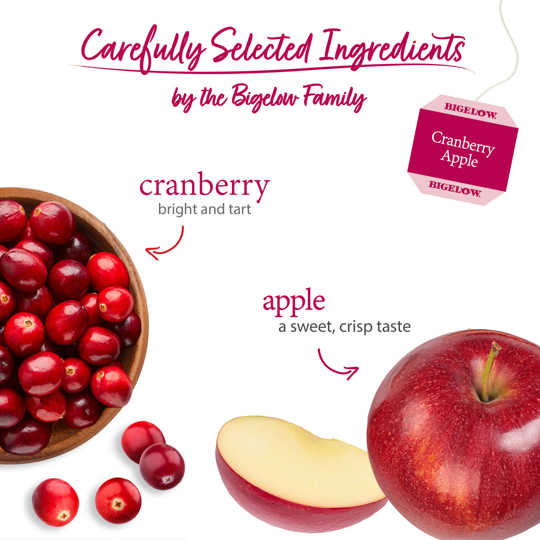 Cranberries and apples with Bigelow Cranberry Apple tea bag label on a white background