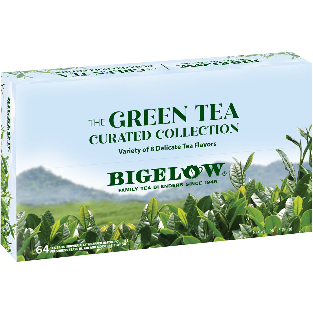 Bigelow Green Tea Curated Collection packaging with tea leaves and mountains in the background
