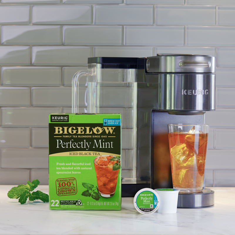 Glass of Perfectly Mint Iced Tea K-cup with box of 22 pods with Keurig brewer