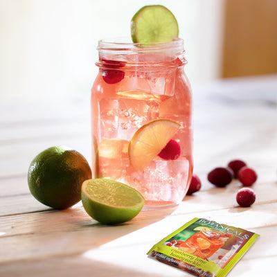 Mason jar filled with Cranberry Lime Honeysuckle Cold Water Infusion 